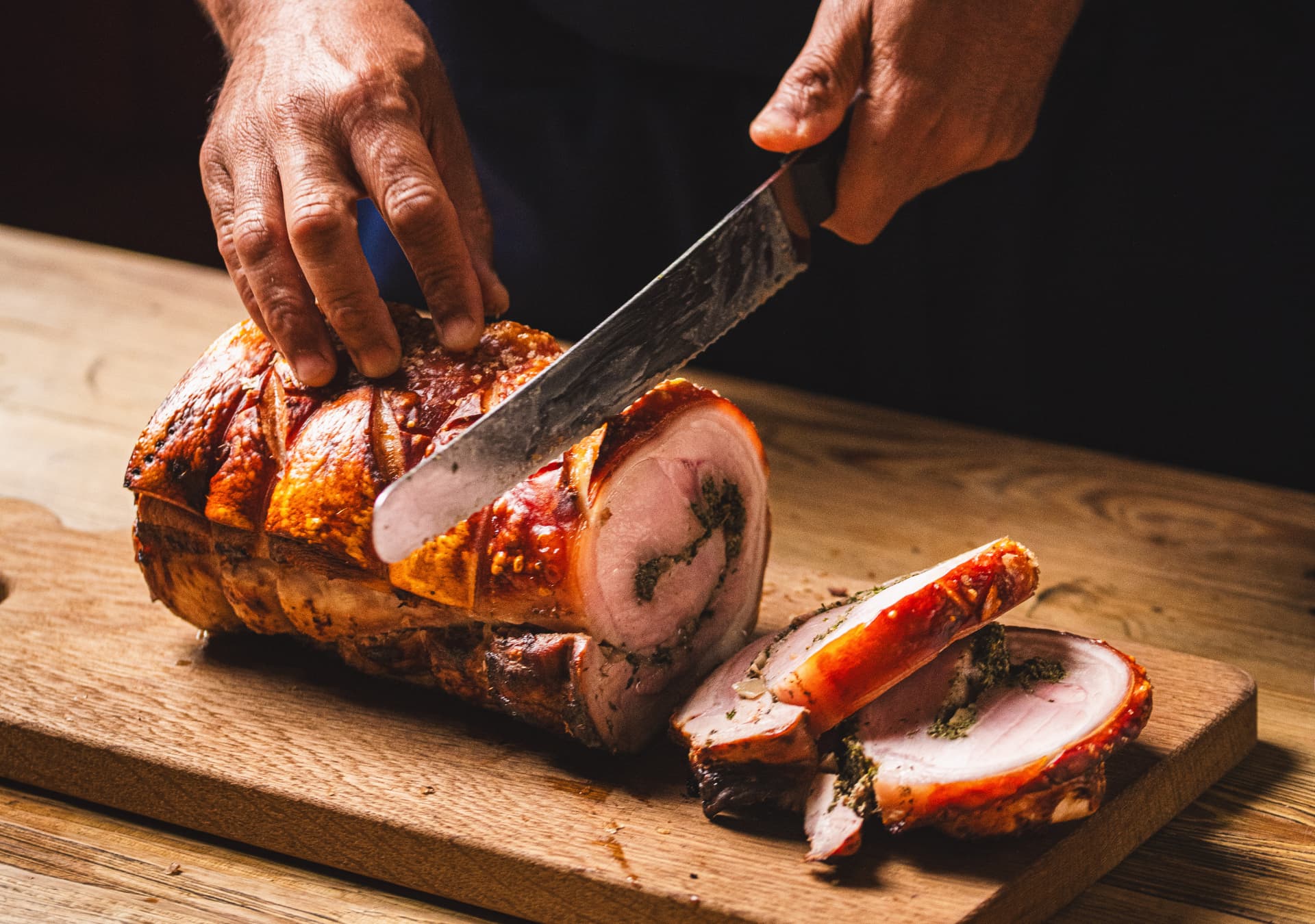 Chef cutting up roast